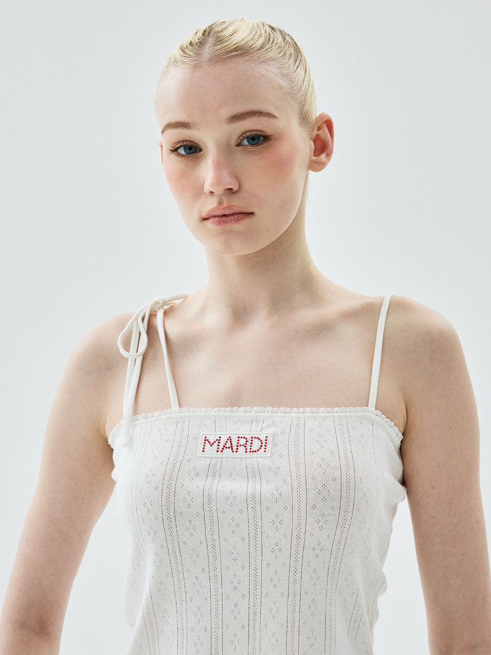 SLEEVELESS EYELET RIBBON DETAIL_IVORY